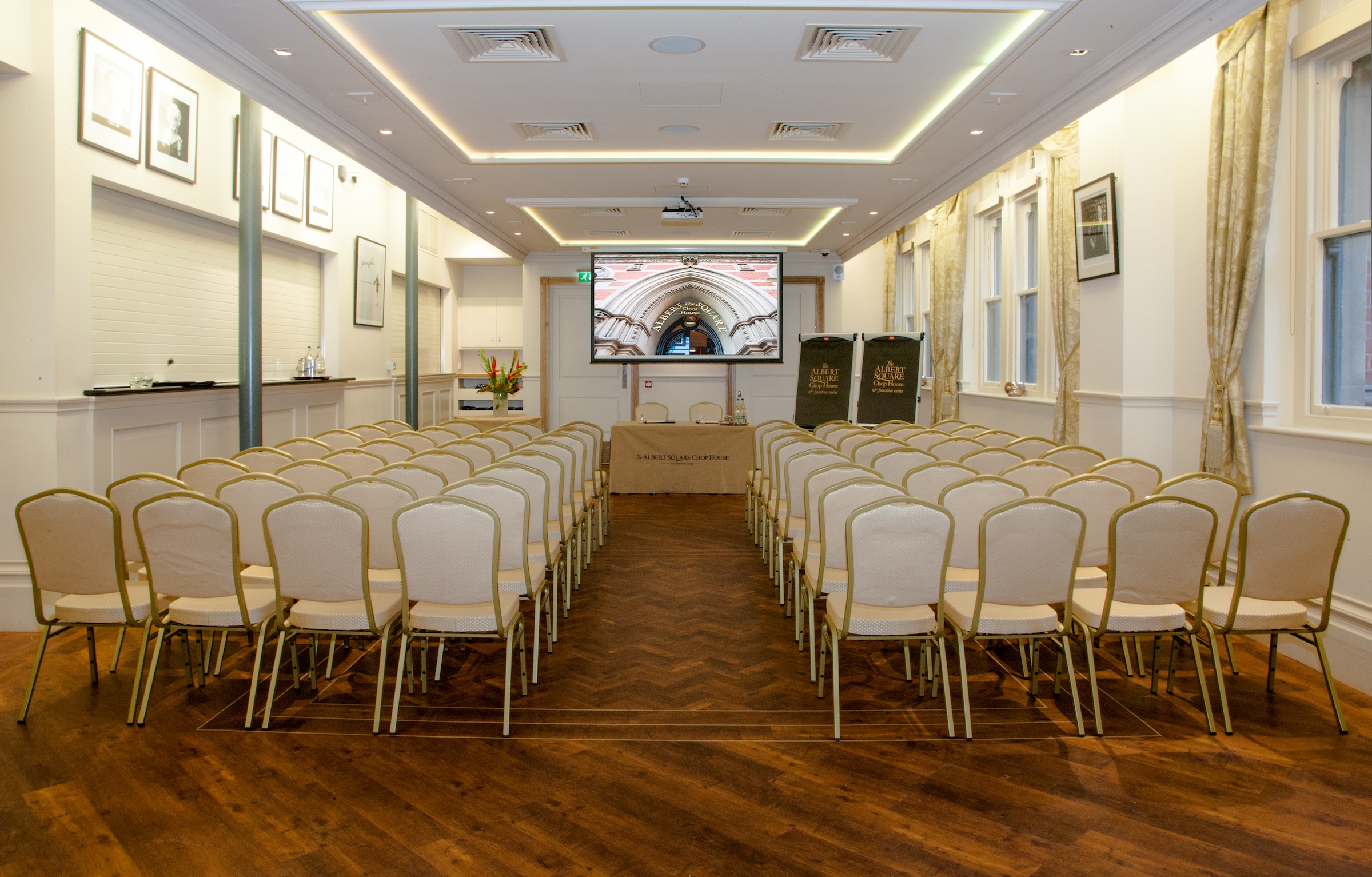 Memorial Hall meeting space with beige chairs, ideal for corporate events and seminars.