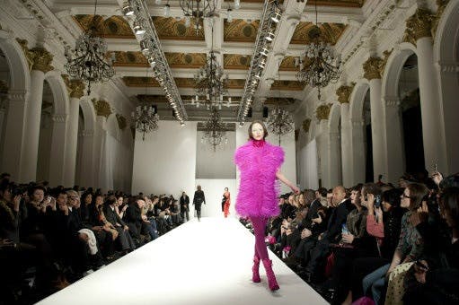 Vibrant fashion runway at 8 Northumberland Avenue with elegant chandeliers.