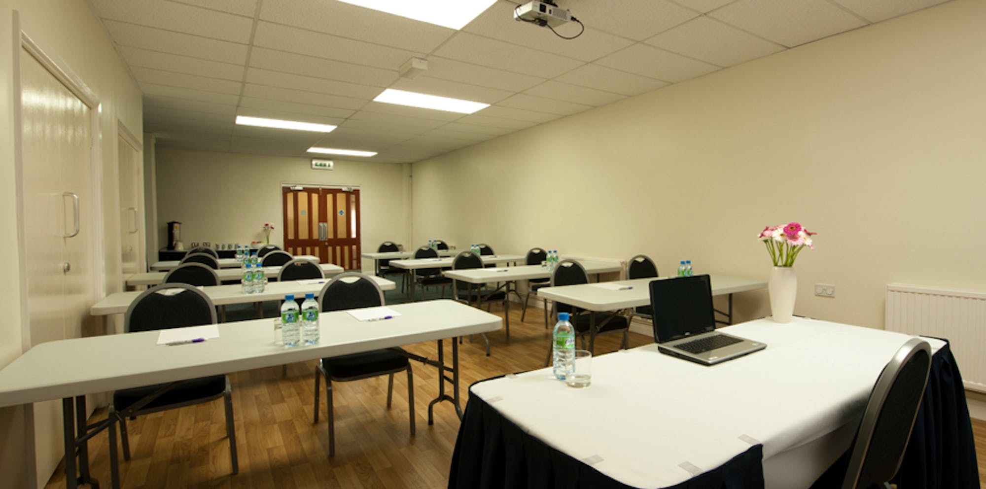 Seminar Room 5 at King's House: organized meeting space for professional events and workshops.