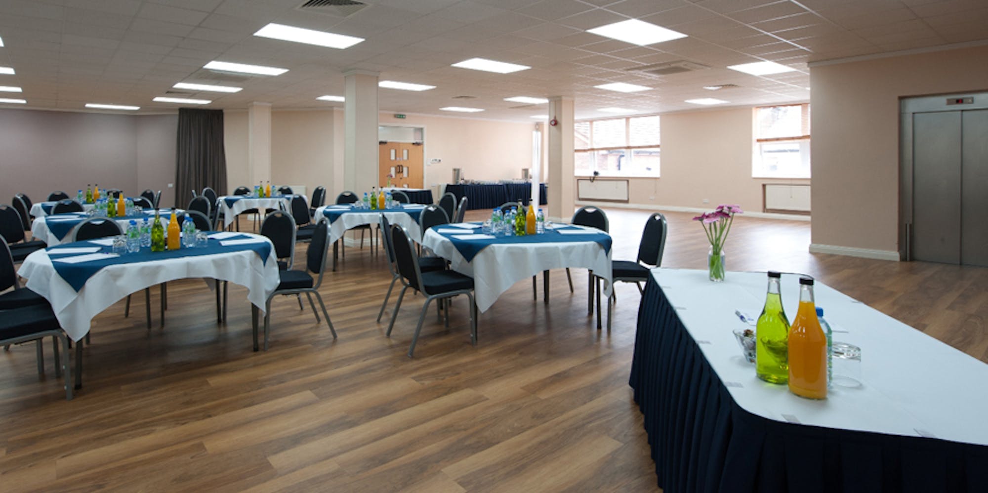 First Floor Hall at King's House, set for a meeting with blue and white linens.