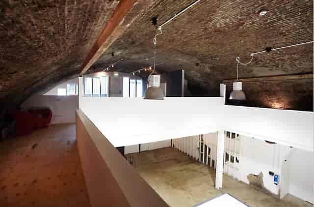 Spacious Studio 2 with arched ceiling for creative workshops and social events.