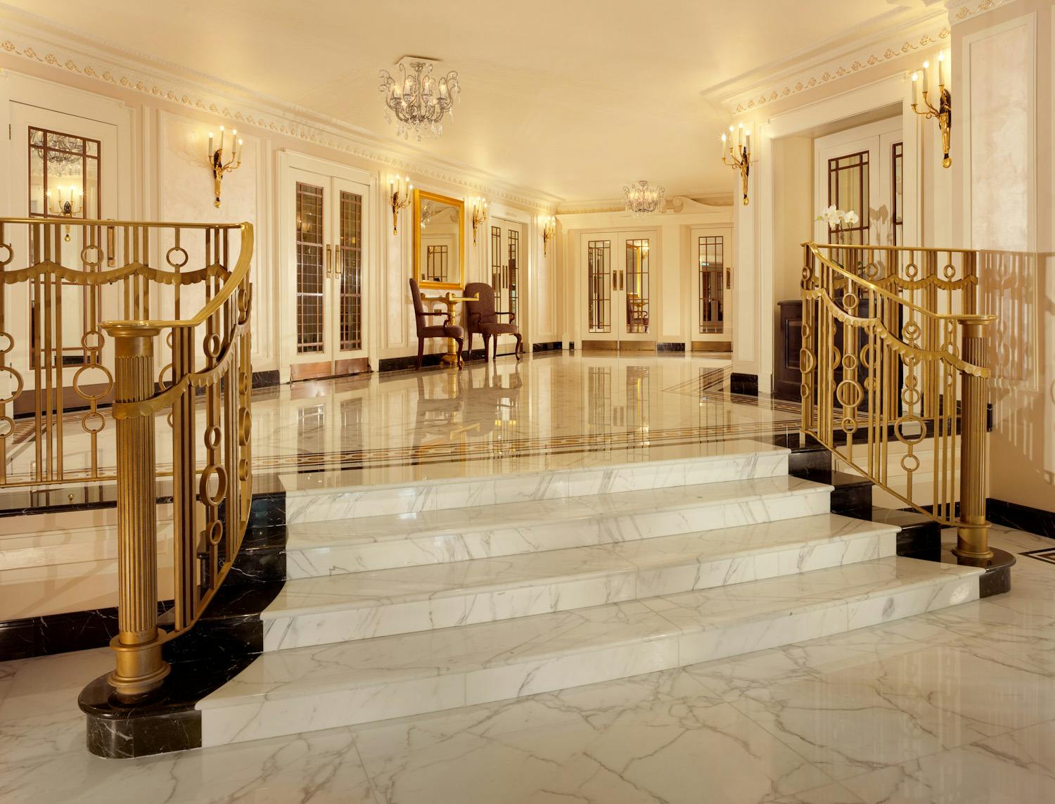 Elegant foyer with grand staircase in The Dorchester Ballroom for upscale events.