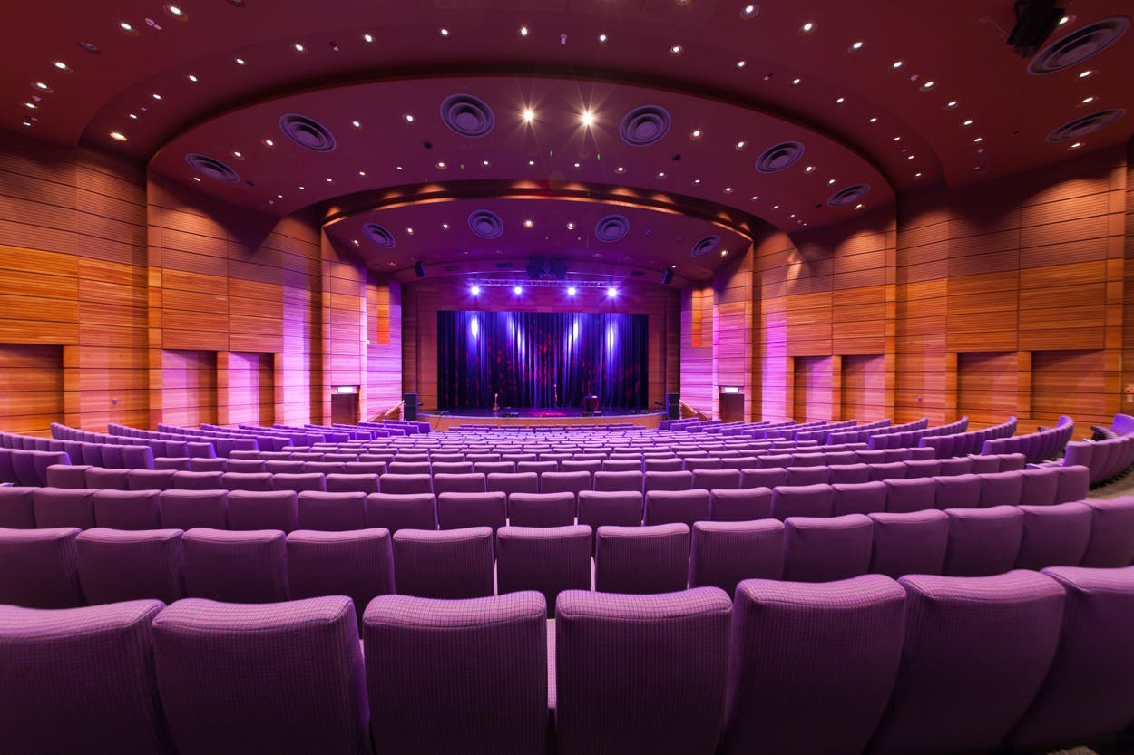 Pentland Auditorium with tiered purple seating, ideal for conferences and events.