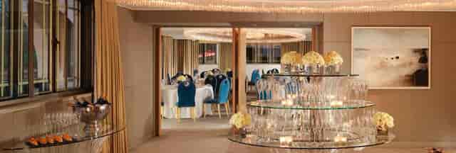 Crystal Suite at The Dorchester featuring teal velvet chairs for luxury banquet and gala events.