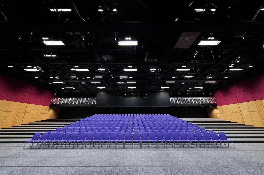 Lennox Suite at Edinburgh Conference Centre with tiered purple seating for events.