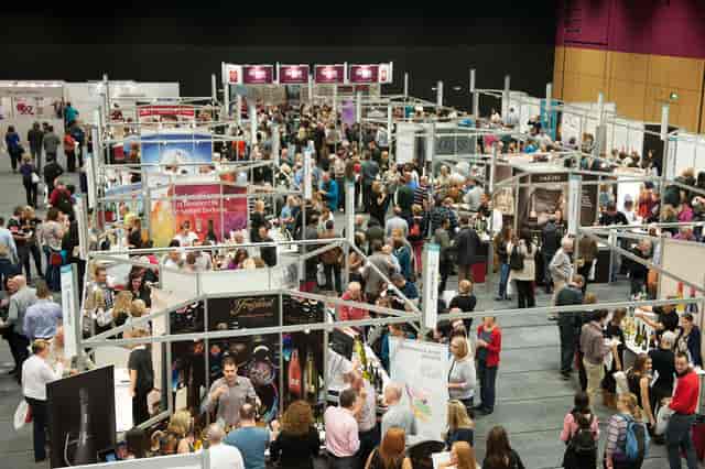 Lennox Suite trade show in Edinburgh, bustling booths and networking atmosphere.