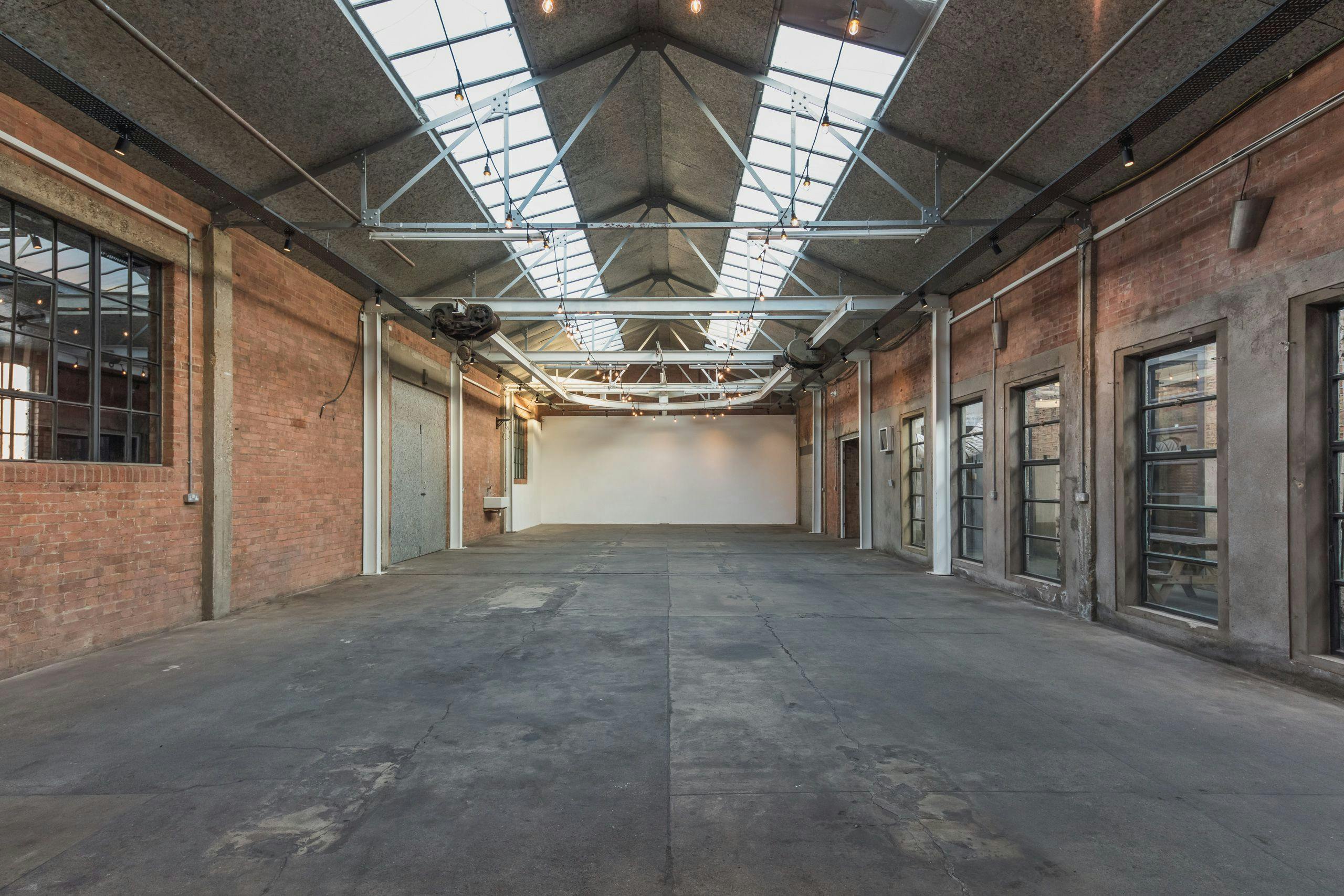 Atrium at Hoxton Docks: spacious industrial venue with exposed brick for events.