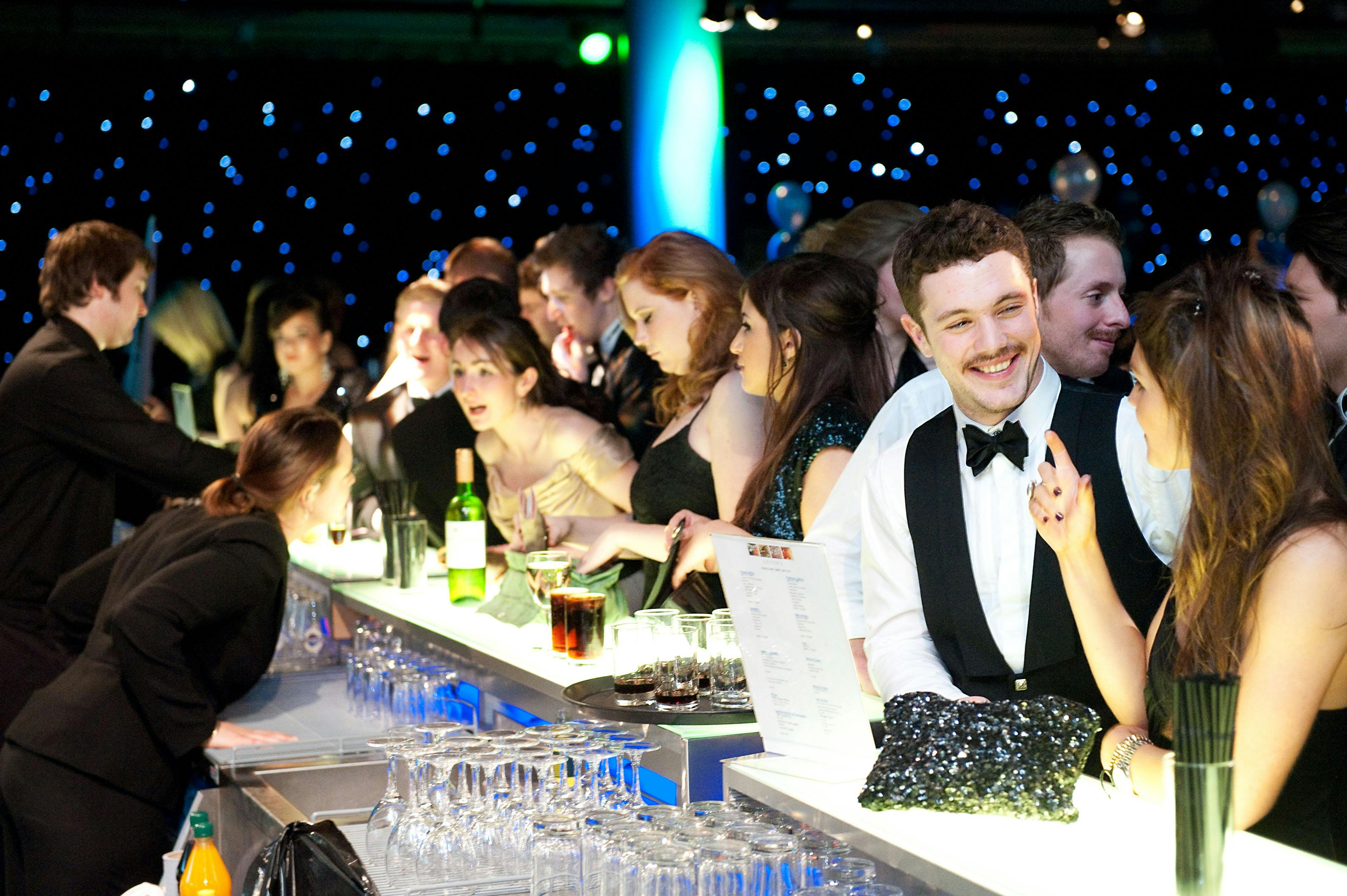 Cromdale Hall at EICC, elegant gala with guests mingling at a stylish bar.