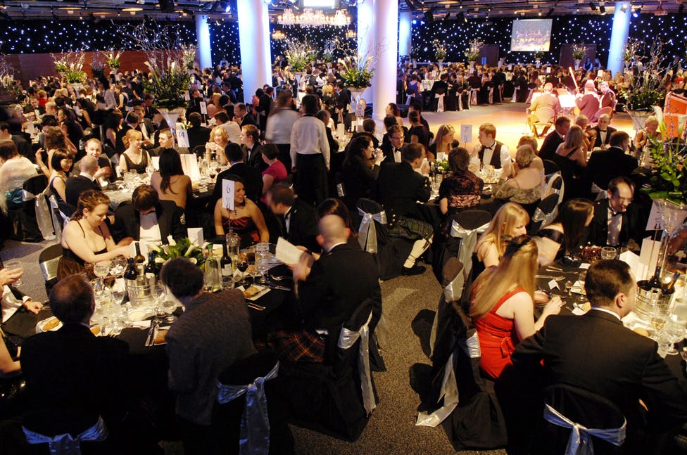Cromdale Hall gala event with elegant decor, floral centerpieces, and networking opportunities.
