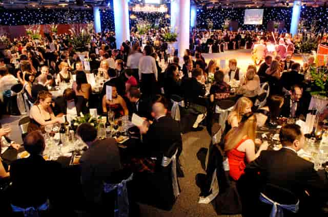 Cromdale Hall gala event with elegant decor, floral centerpieces, and networking opportunities.