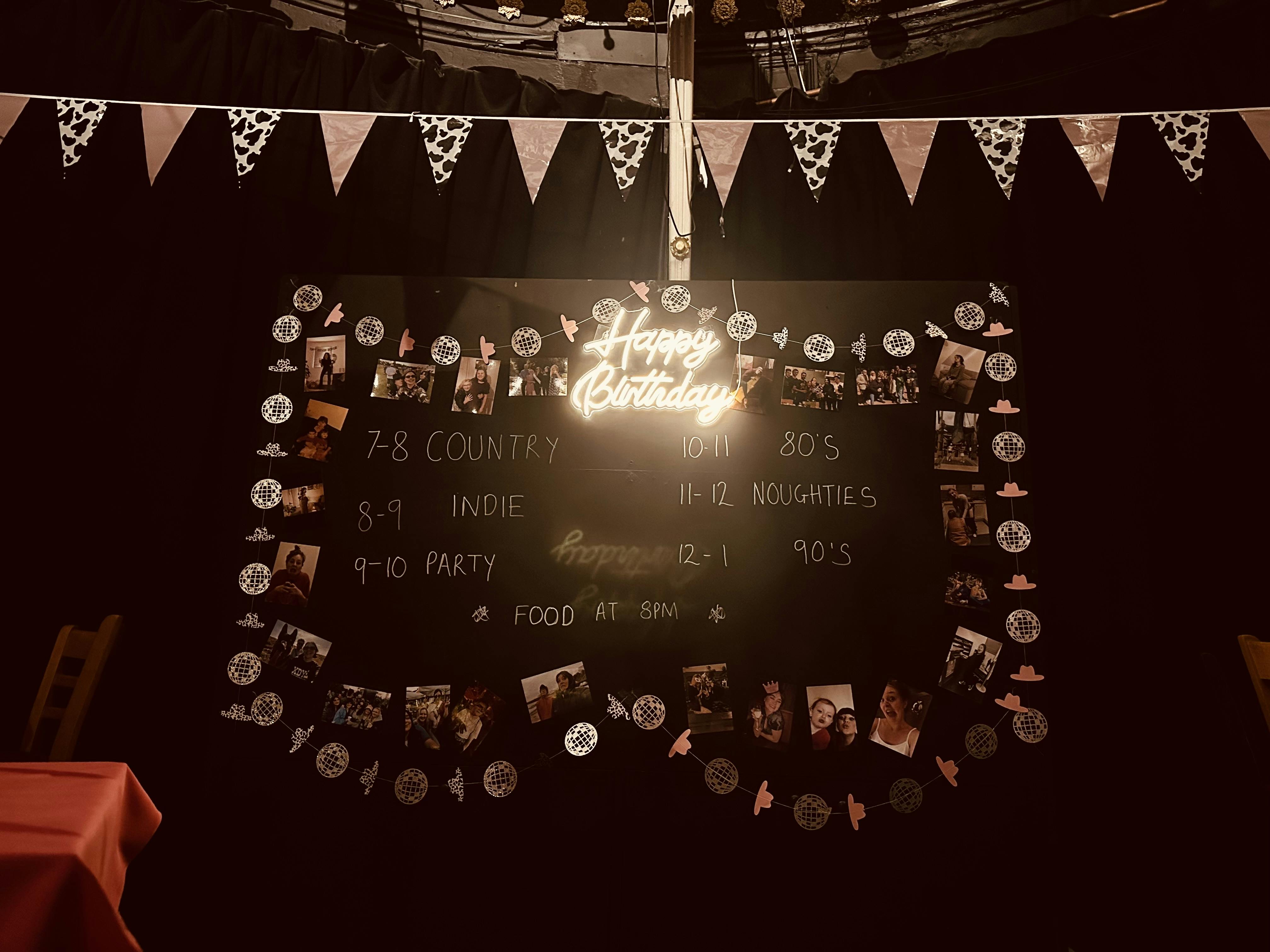 Kings Arms Theatre birthday event board with music timeline and festive decor.