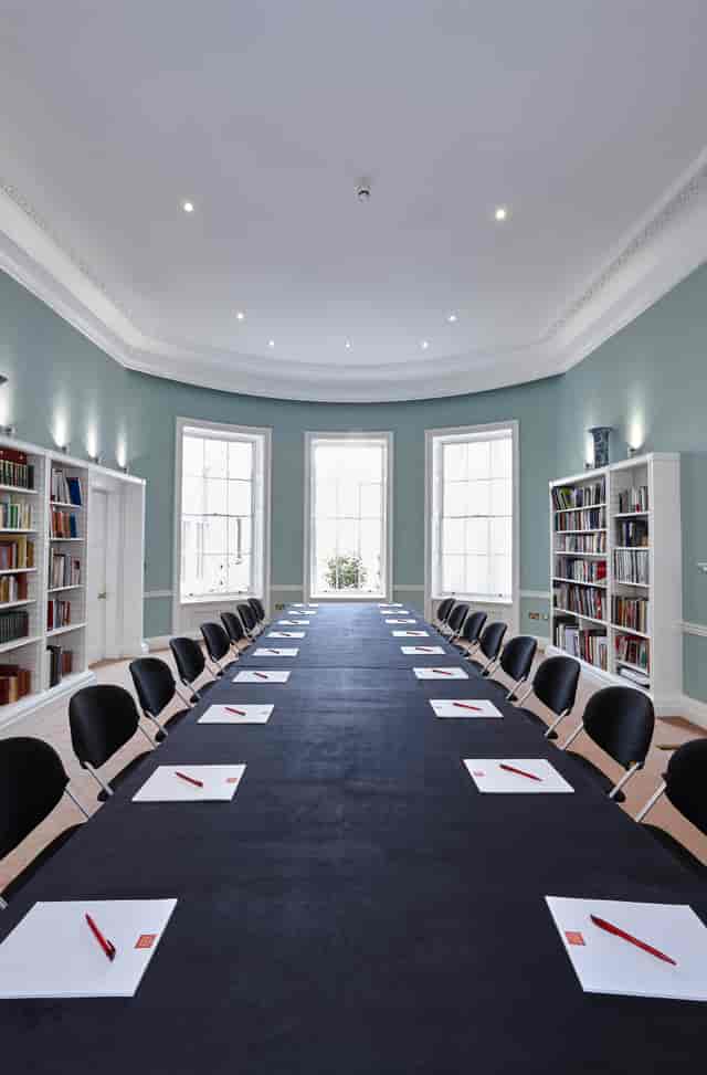 Library meeting room in Asia House with natural light, ideal for professional gatherings.