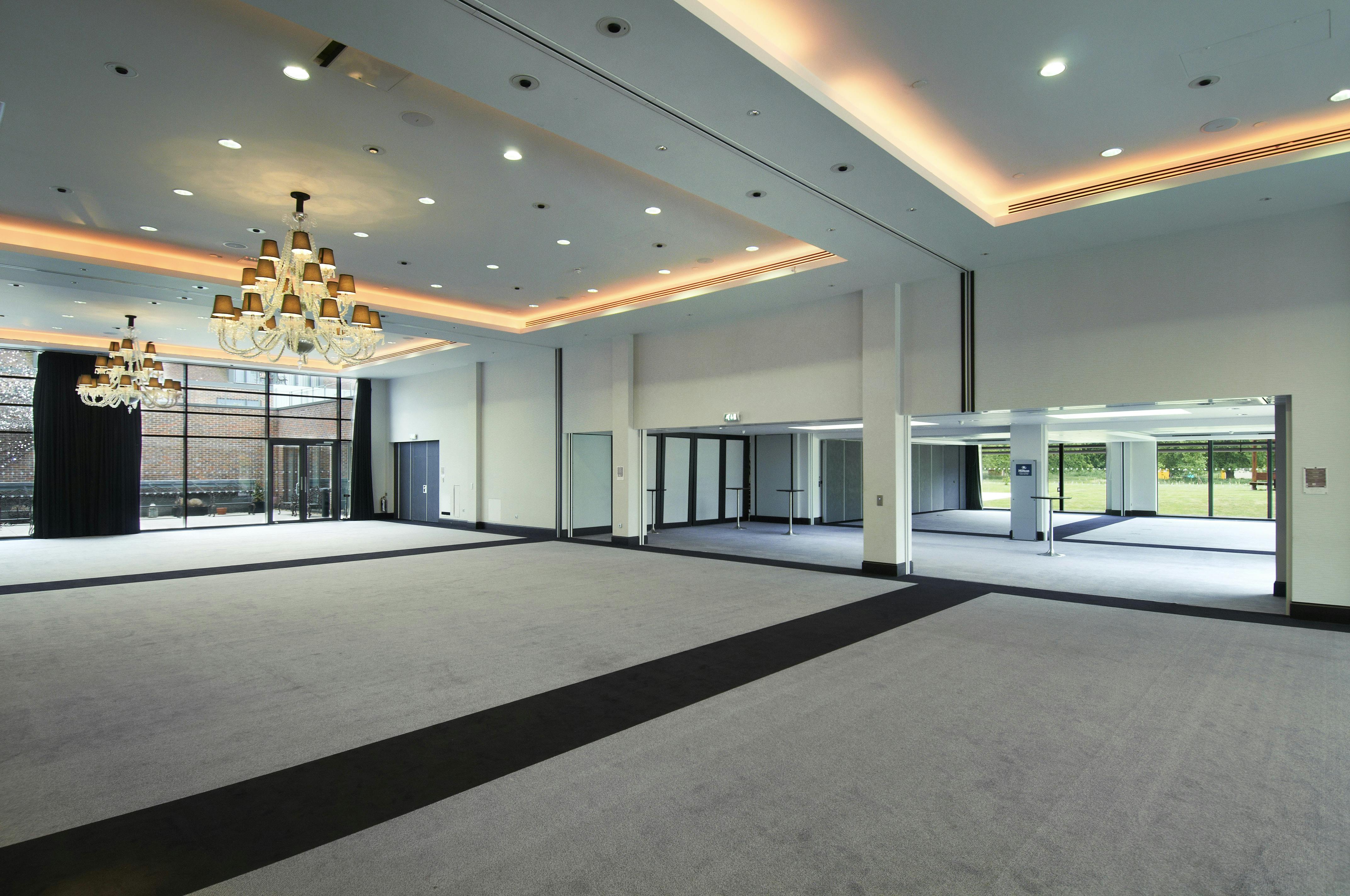 Grand Syon Ballroom with elegant chandeliers, ideal for conferences and banquets.
