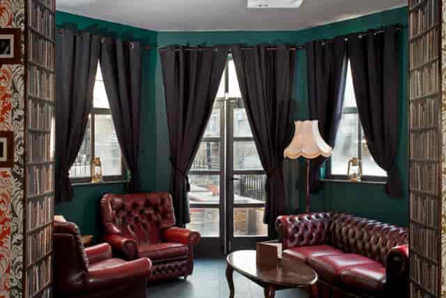Cozy Lounge Bar & Terrace with leather seating, ideal for meetings and gatherings.