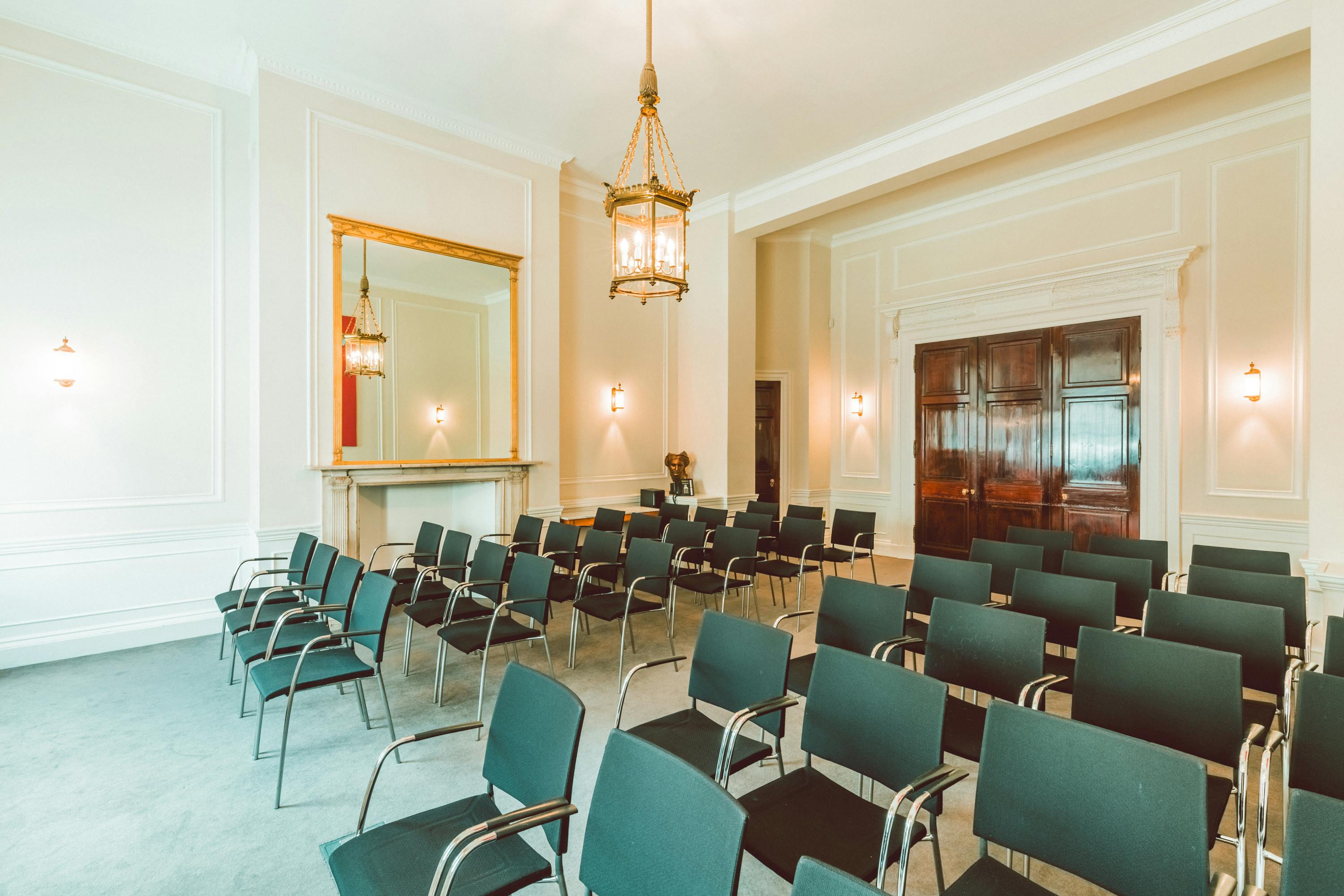 Laurie Landeau in elegant meeting room, ideal for corporate events and seminars.