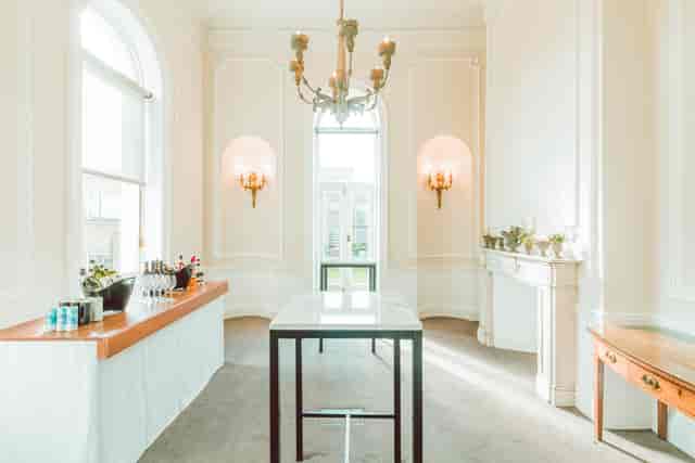 Elegant wedding venue with large windows, perfect for networking and social events.