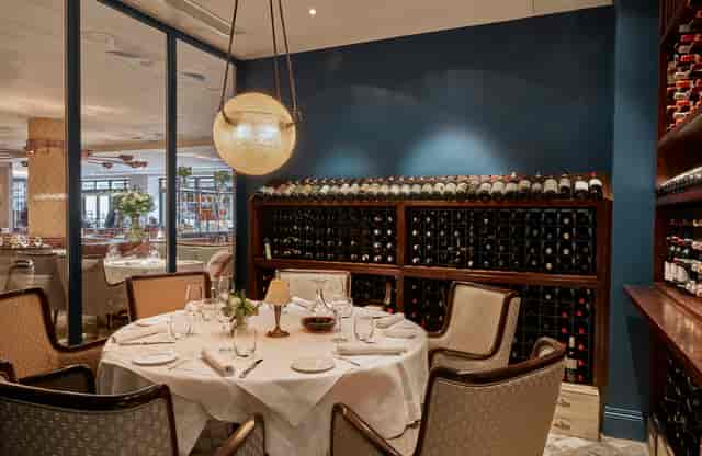 Elegant dining venue with round table, ideal for corporate dinners and private events.
