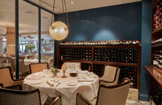 Elegant dining venue with round table, ideal for corporate dinners and private events.