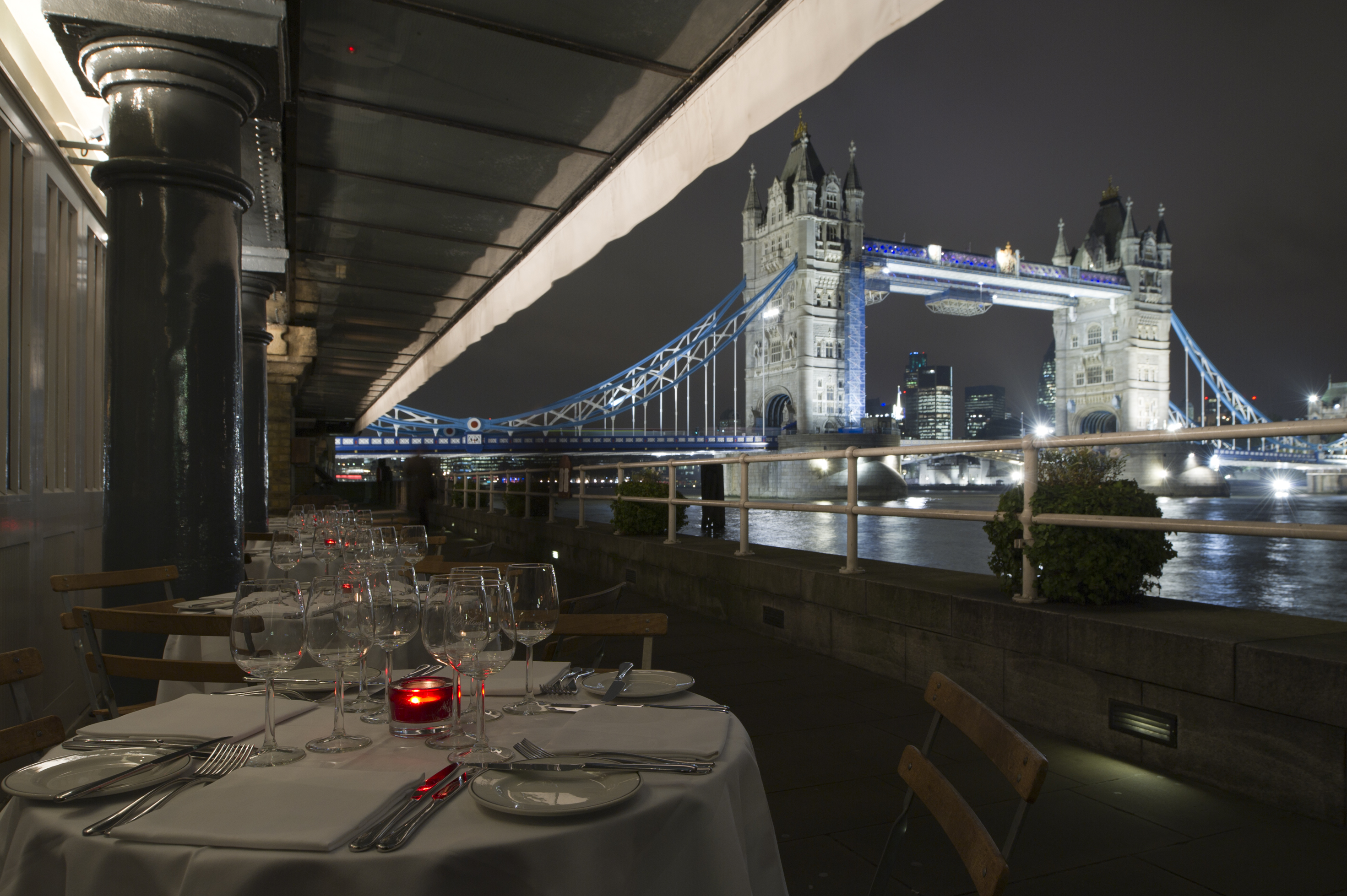 Elegant outdoor dining at Butlers Wharf with Tower Bridge view, perfect for upscale events. - Banner