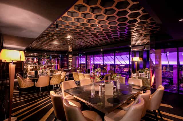 Prince of Wales Room at Quaglino's with honeycomb ceiling, ideal for upscale events.