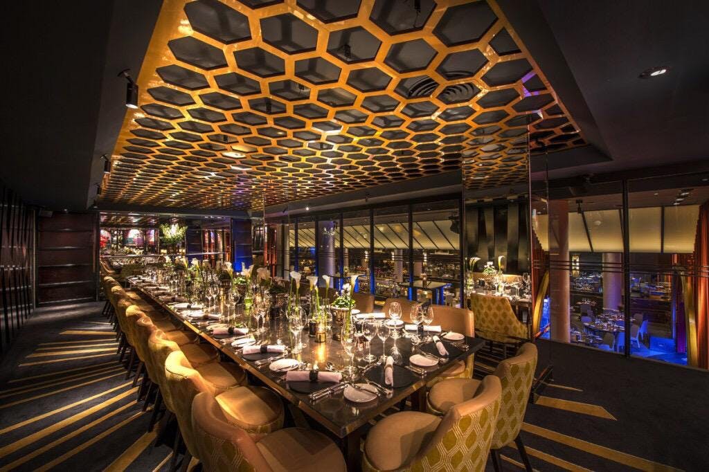 Prince of Wales Room at Quaglino's with honeycomb ceiling, perfect for upscale events.