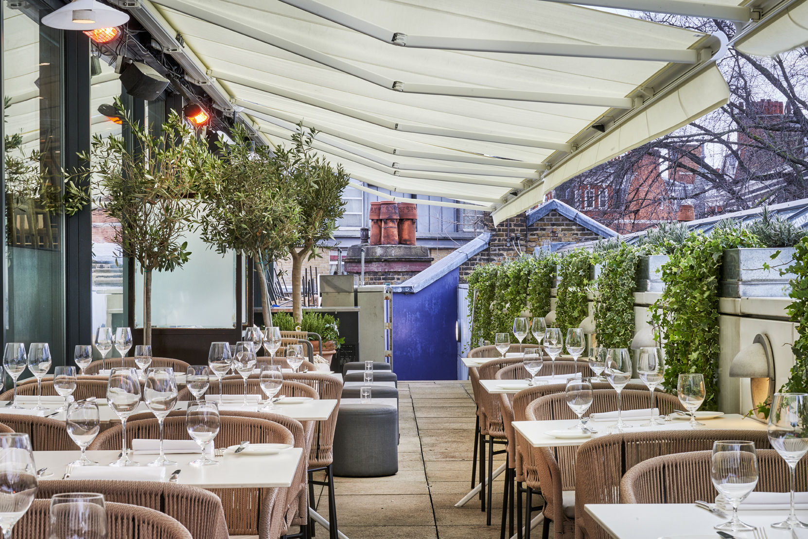 Stylish outdoor dining venue with elegant table settings for events in Orrery. - Banner