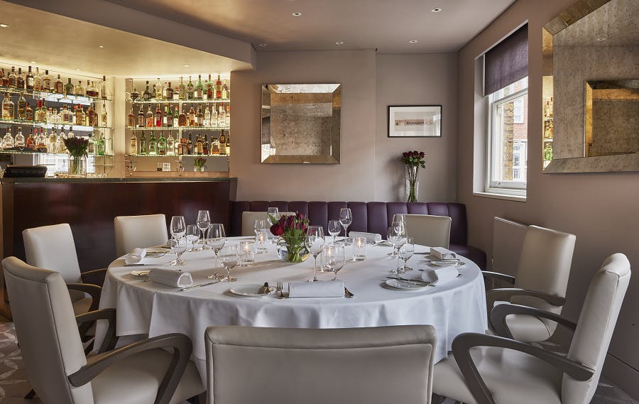 Elegant round table in Orrery's private dining room for intimate events and meetings.