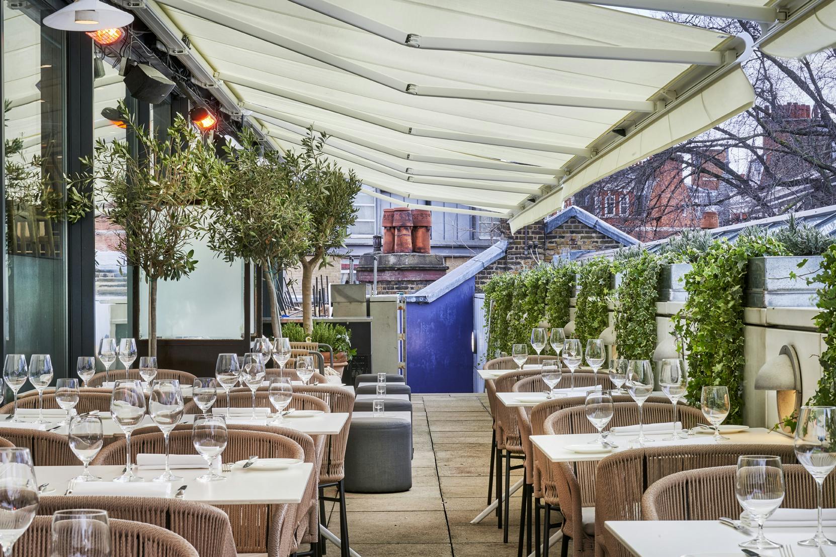 Stylish outdoor dining space with elegant table settings for events in Orrery.