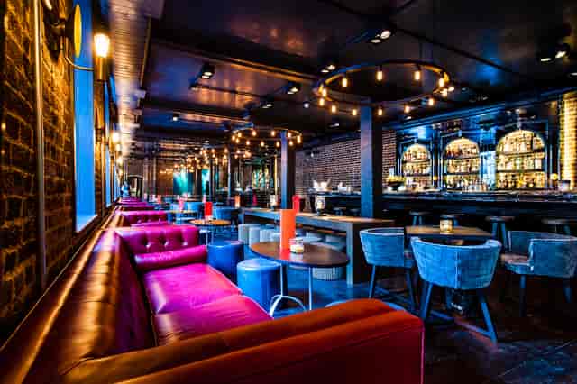 Stylish event space in Old Bengal Bar with vibrant seating for cocktail receptions.