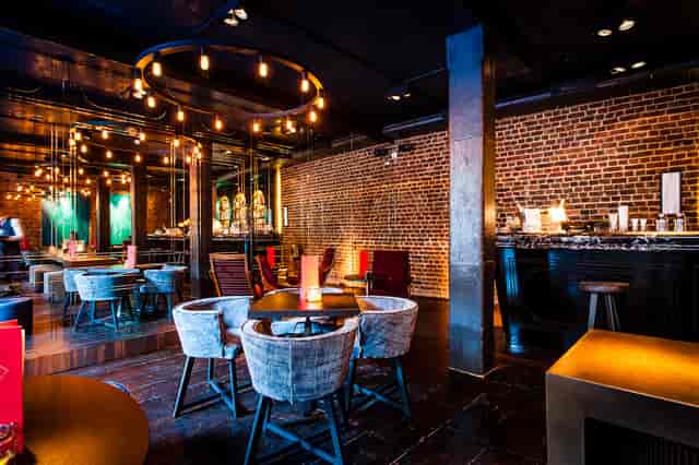Stylish Old Bengal Bar venue with warm lighting for intimate gatherings and networking events.