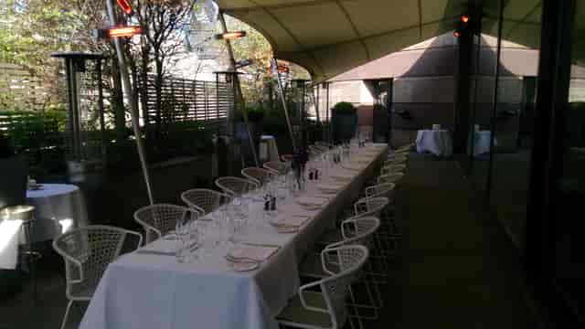 Elegant outdoor dining at Bar Terrace, Coq d'Argent for sophisticated events.