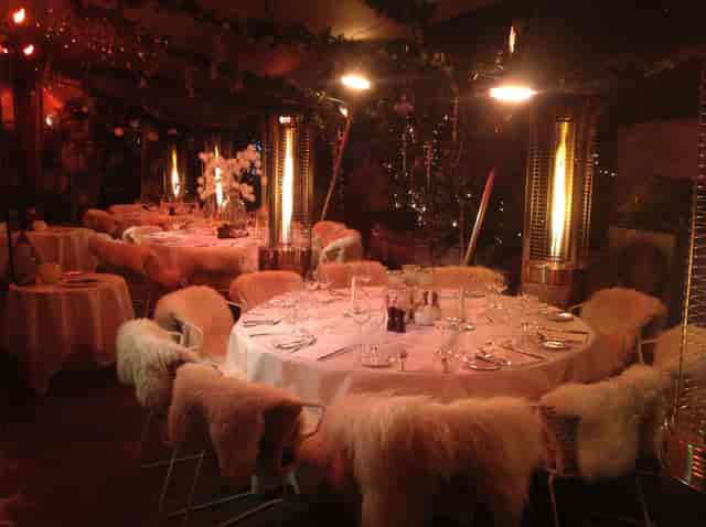 Elegant Bar Terrace dining with white linens, perfect for winter events and gatherings.