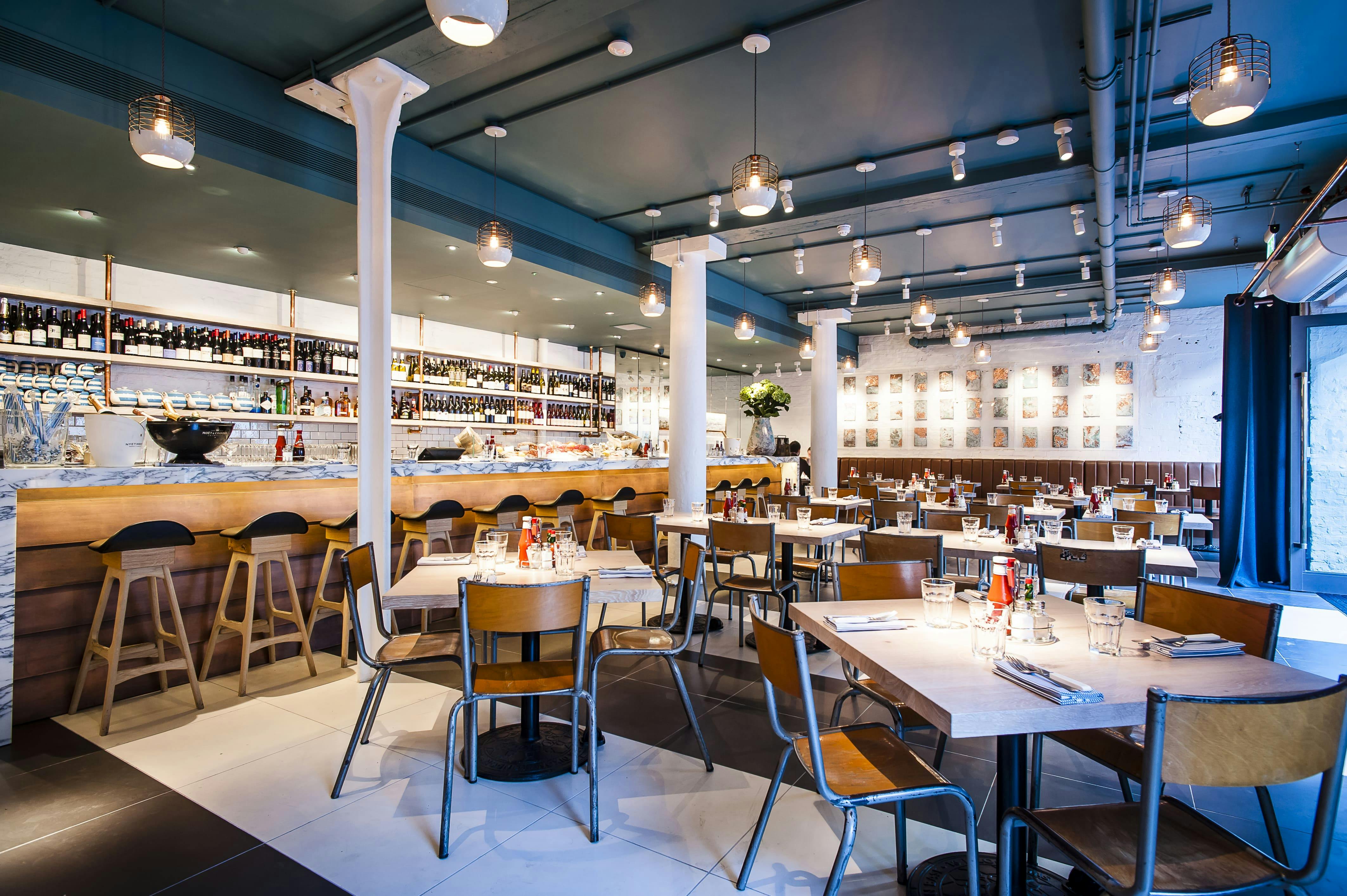 Modern restaurant venue in Fish Market, ideal for events with flexible seating and warm lighting.