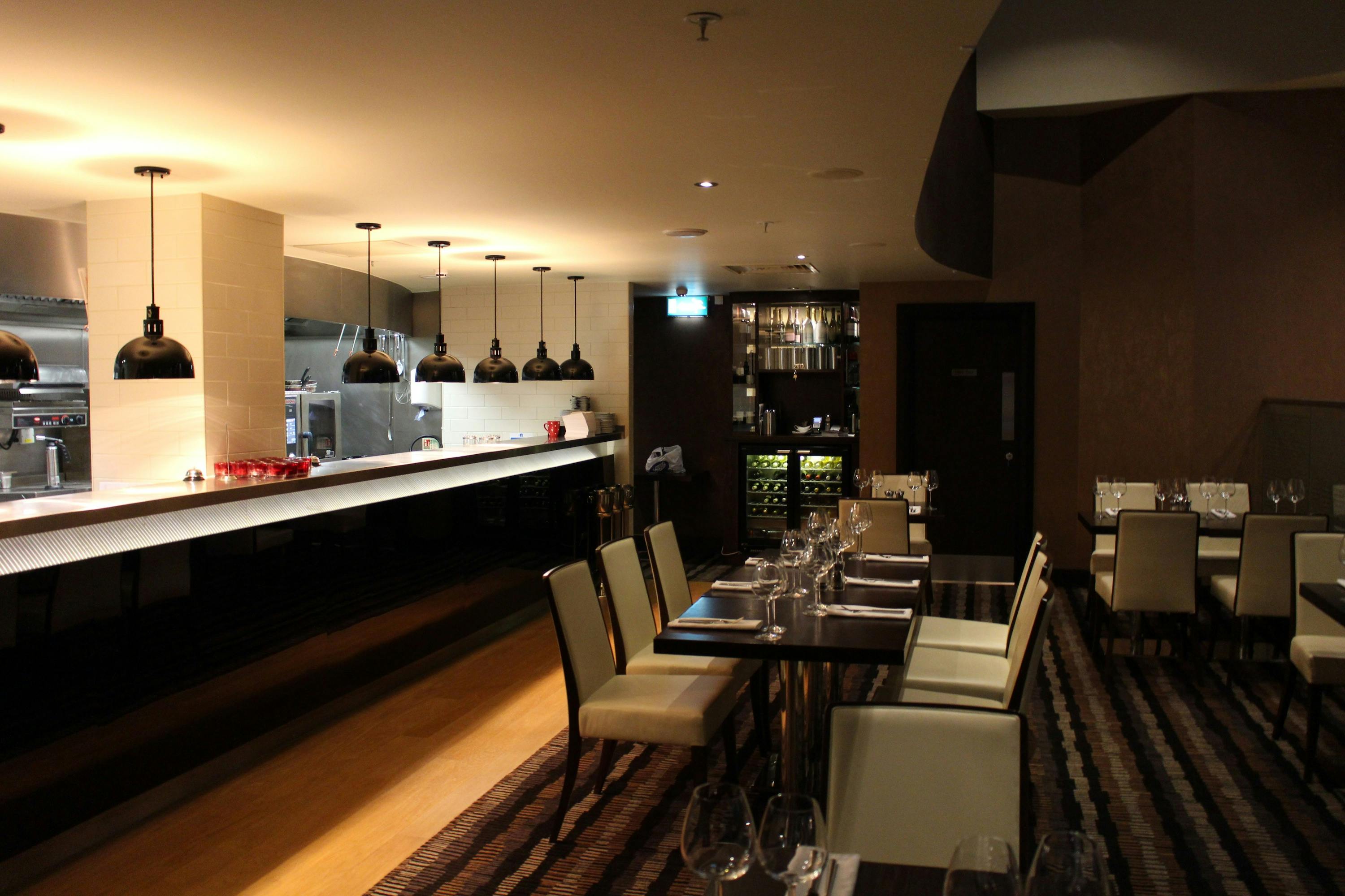 Sleek dining space at Fahrenheit Restaurant, ideal for corporate events and intimate gatherings.