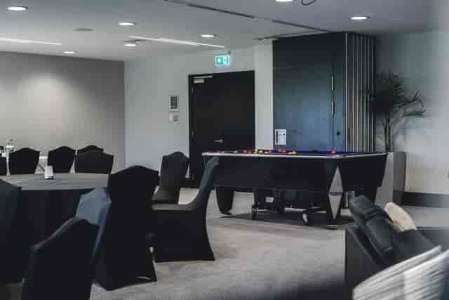 Versatile event space at Dukes, Hilton London Syon Park with modern decor and pool table.