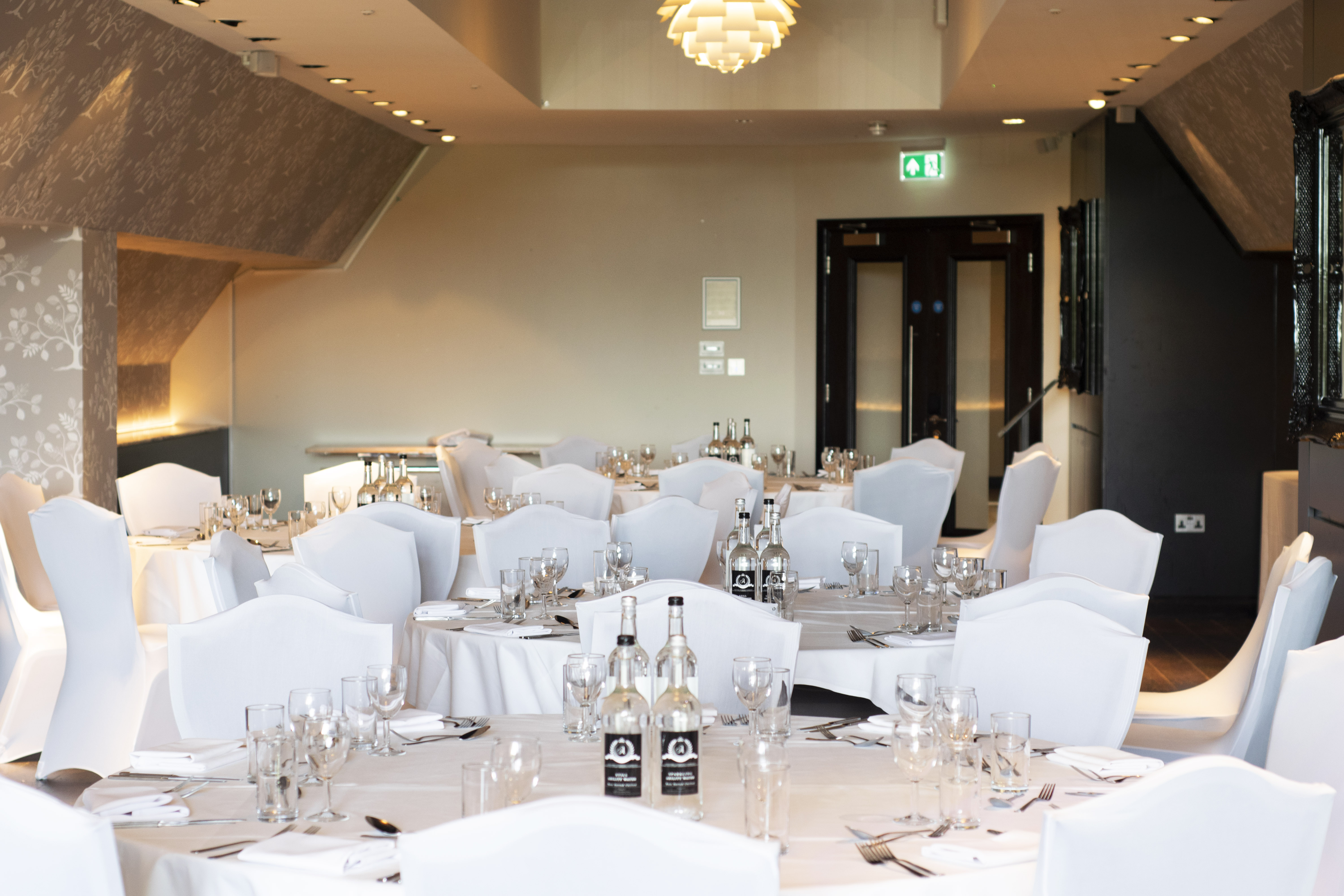 Elegant banquet room at The Clubhouse, Hilton London Syon Park for weddings and corporate events. - Banner