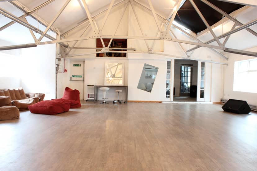 Versatile event space at Kraak Gallery with natural light, ideal for workshops and networking.