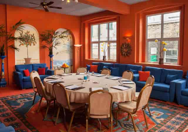 The Orangery breakout room: colorful, creative event space for modern workshops and meetings.