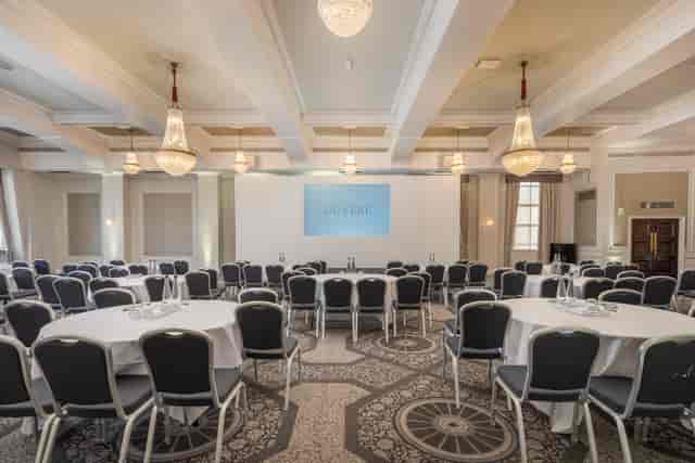 Grand Connaught Rooms Edinburgh ballroom with elegant chandeliers for corporate event or conference.