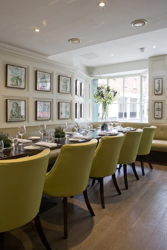 Stylish dining space in The Snug, ideal for intimate meetings and corporate events.