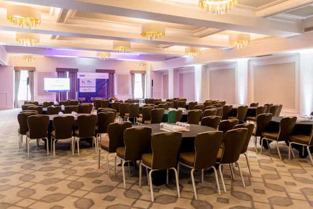 Crown & Cornwall Suite: elegant meeting space with round tables for corporate events.