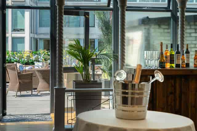 Corporate reception at Grand Connaught Rooms penthouse with terrace bar for business events.