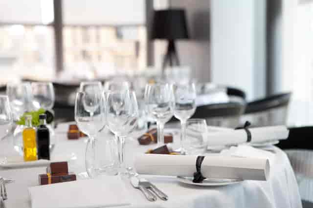 Elegant dining table setup at The Second Floor Bar for corporate events and formal dinners.