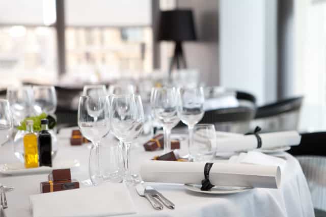 Elegant dining table setup at The Second Floor Bar for corporate events and formal dinners.