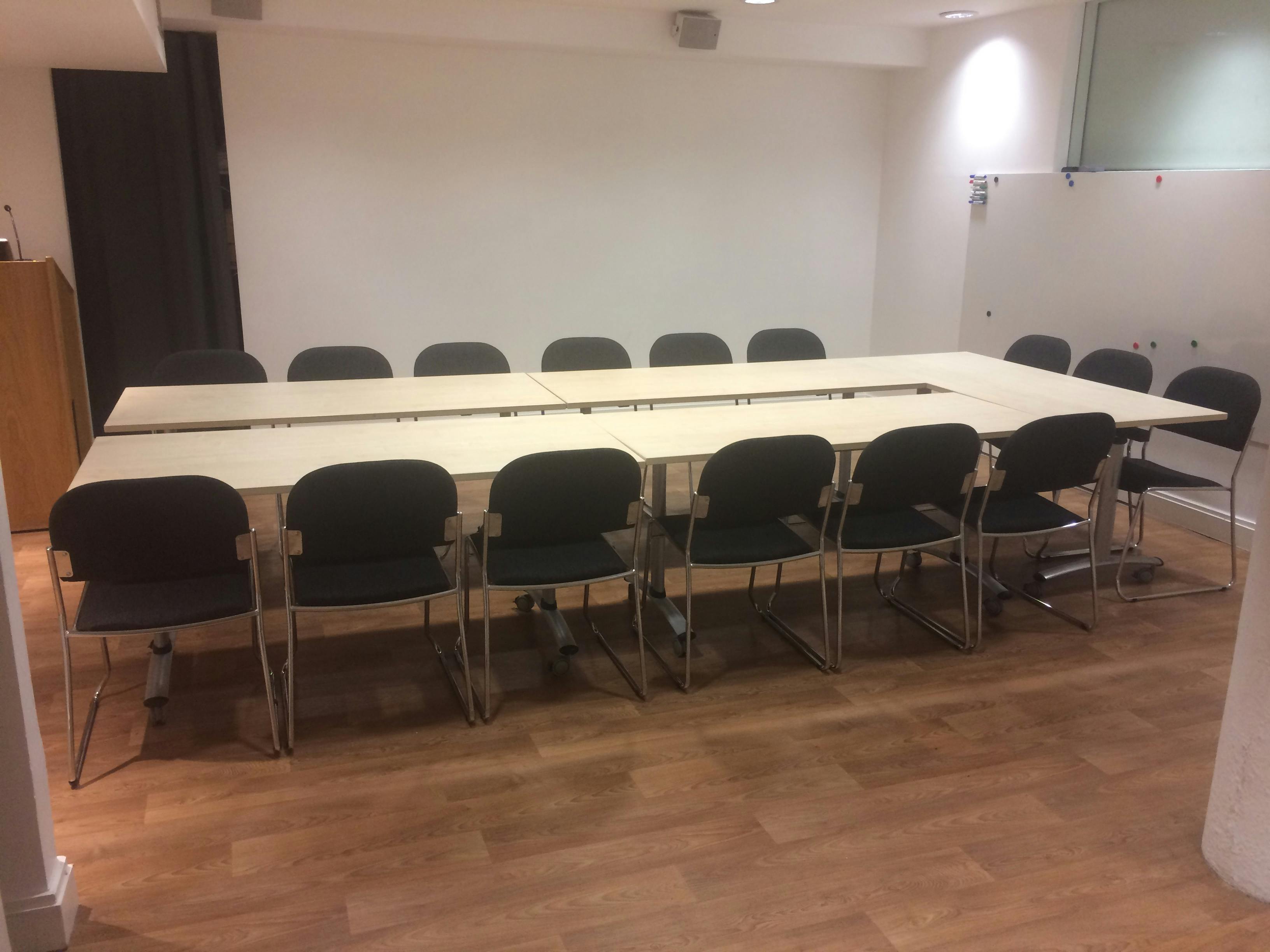 Esea Studio meeting room with long table, ideal for collaborative discussions and presentations.