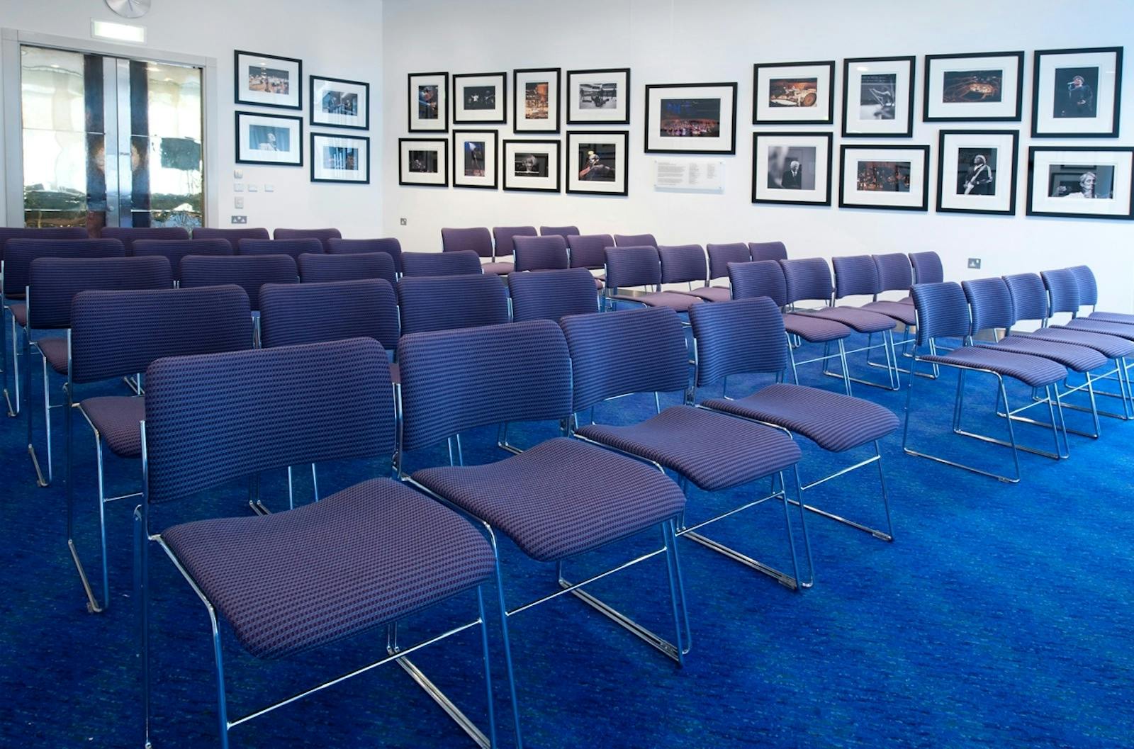 Charles Halle Room at Bridgewater Hall, organized meeting space with blue carpet, event-ready.