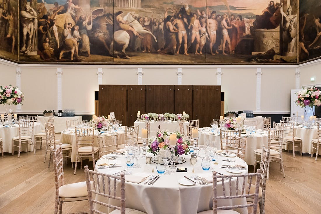 Elegant banquet hall in RSA House with floral centerpieces, ideal for weddings and events.