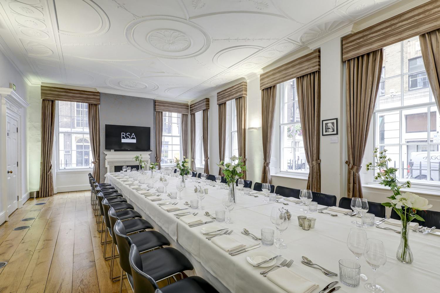 Elegant Tavern Room at RSA House with fine dining setup for meetings and events.