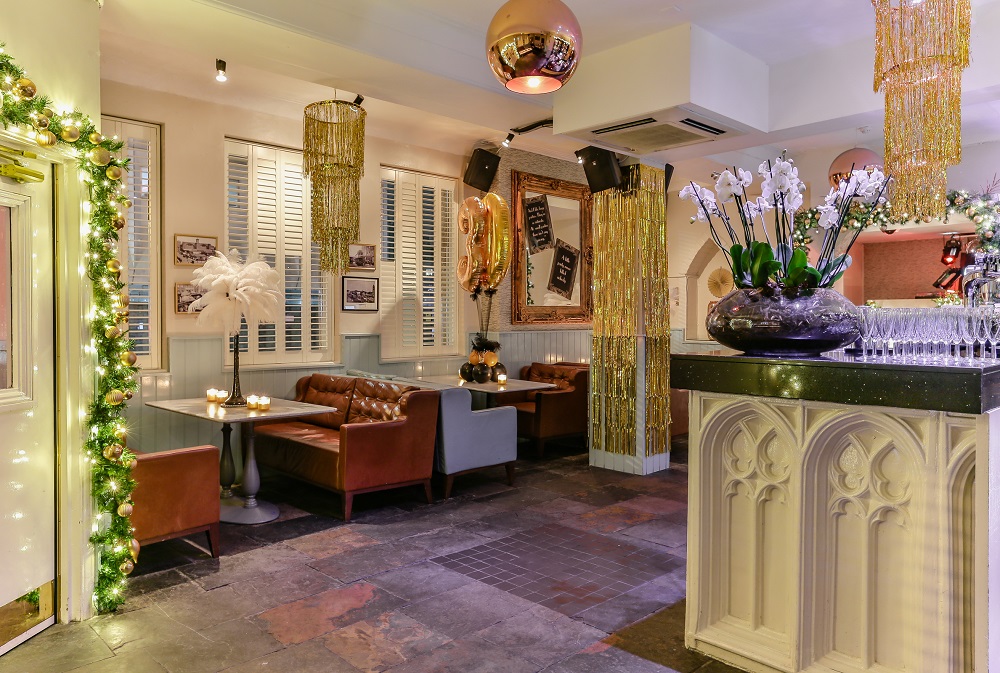 Stylish event space in The Chapel Bar with cozy seating for gatherings and meetings. - Banner