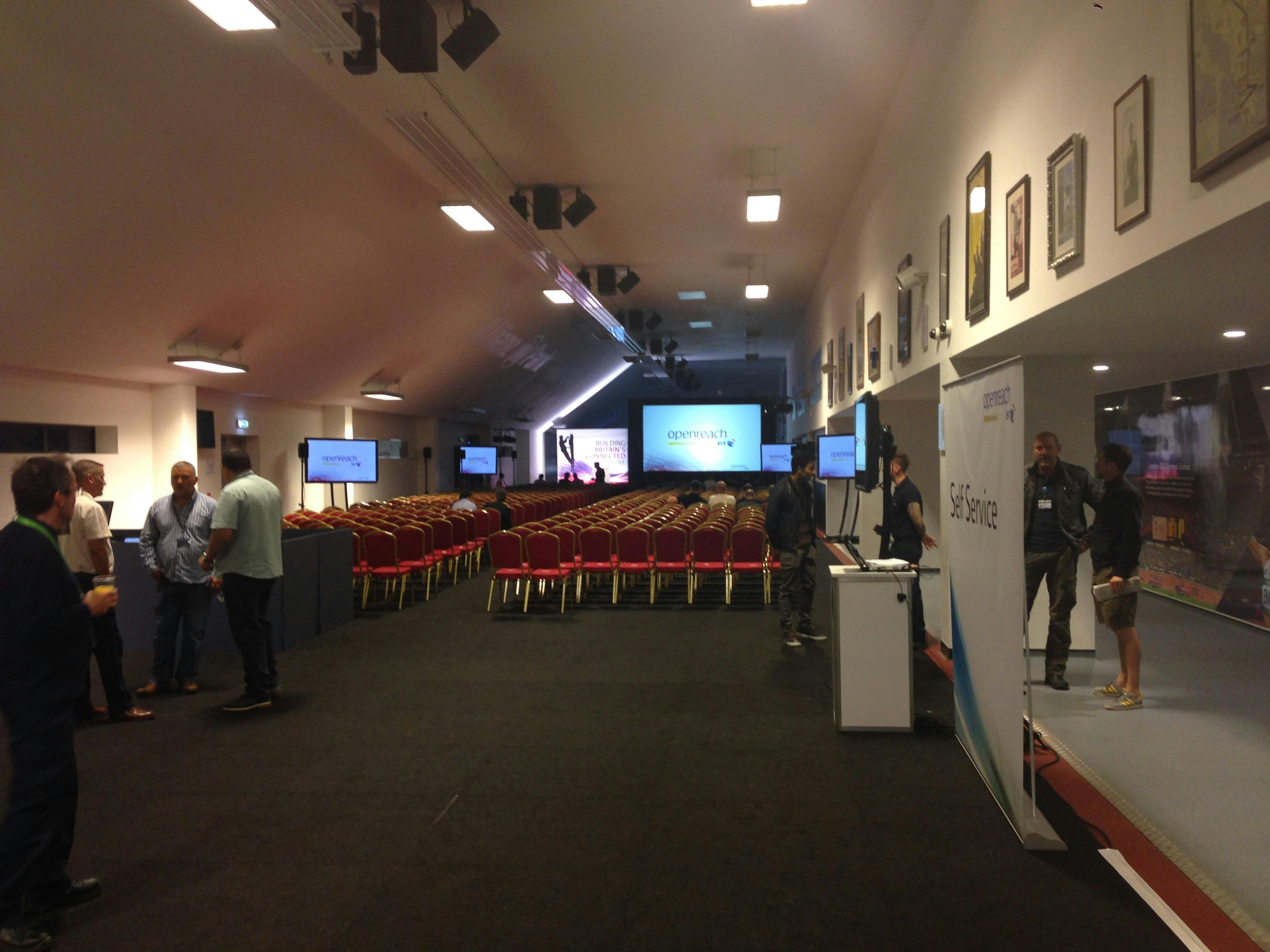 Olympic Bar at StoneX Stadium, spacious event space with chairs for presentations and networking.